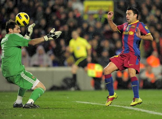 Saturday's clash between Barcelona and Real Madrid will be the first El Clasico since 1999 not to feature Iker Casillas or Xavi- click the arrow above to see what the world was like all those years ago