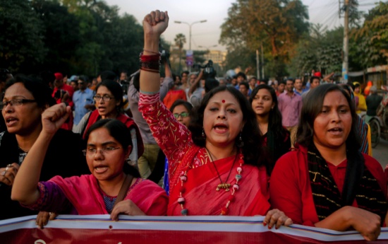 Bangladeshi activists campaigning for capital punishment for war criminals march in a rally as they celebrate the execution of two opposition leaders in Dhaka