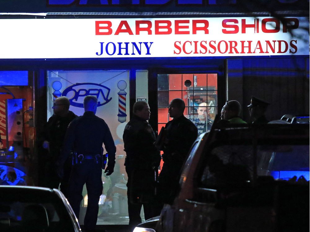 Police deal with a fatal shooting in a strip mall at 20th avenue and 52nd street