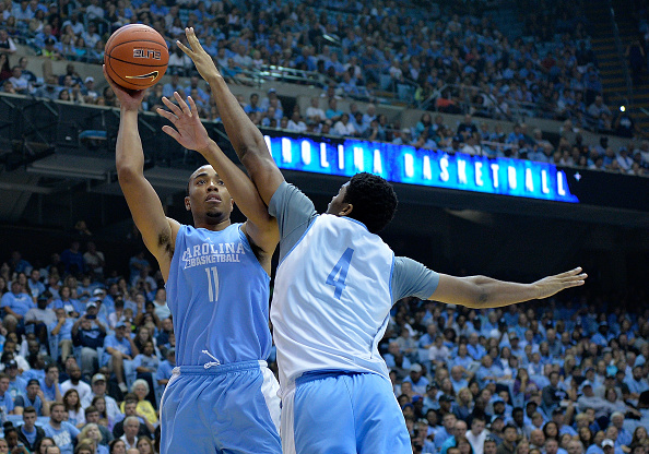 Brice Johnson #11 shoots over Isaiah Hicks #4 of the North Carolina Tar Heels