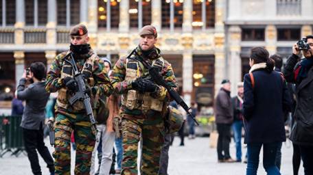 Paris returns to cafes as hunt for terror suspects continues