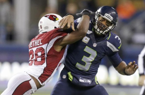 Seattle Seahawks quarterback Russell Wilson is hit