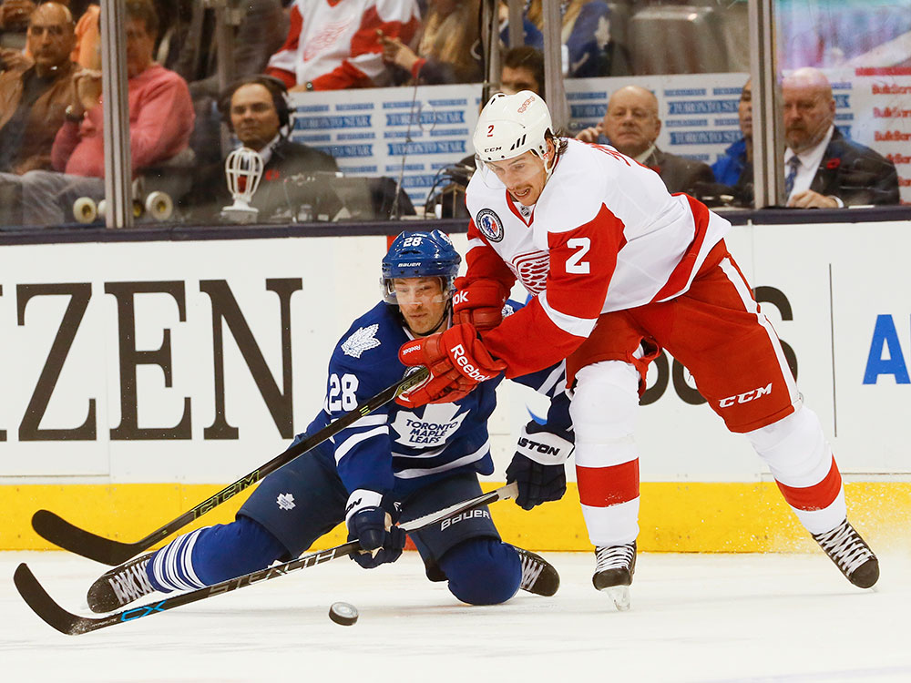 Leafs Brad Boyes gets taken off the puck by Brendan Smith in 1St period action as the Toronto Maple Leafs take on the Detroit Red Wings tonight at the Air Canada Centre in Toronto on Sunday