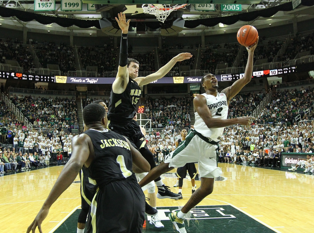 Nov 20 2015 East Lansing MI USA Michigan State Spartans forward Javon Bess lays the ball up against Arkansas Pine Bluff Golden Lions forward Trent Whiting during the 1st half of a game at Jack Breslin Student Events Center. Mandatory Credit