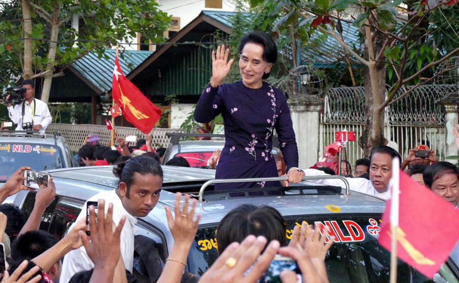 Burma's opposition leader Aung San Suu Kyi greets supporters in Yangon Sunday. Pic AP