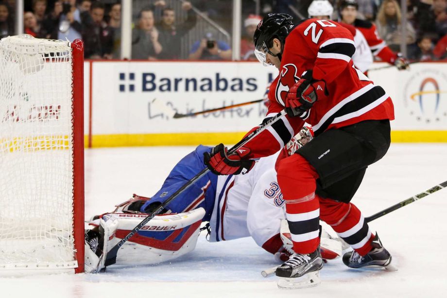 New Jersey Devils right wing Lee Stempniak scores a goal on Montreal Canadiens goalie Mike Condon during the second period of an NHL hockey game Friday Nov. 27 2015 in Newark N.J