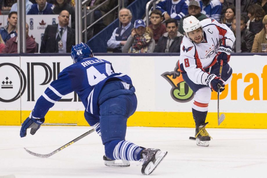 Washington Capital's Alex Ovechkin shoots on goal as Toronto Maple Leafs Morgan Reilly looks on during the first period of an NHL hockey game in Toronto Saturday Nov. 28 2015. MANDATORY CREDIT