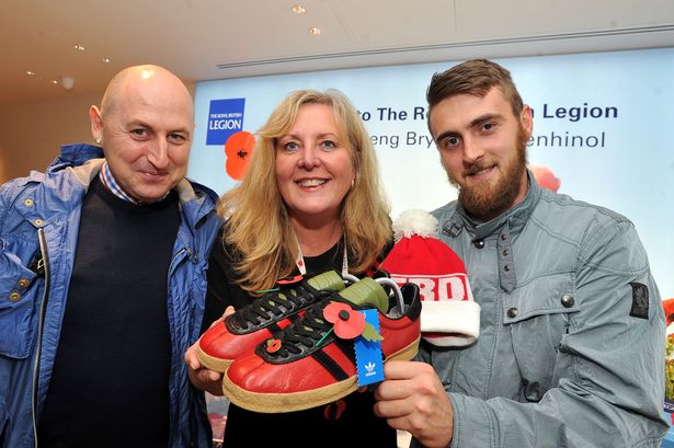 Carl Denys Jones, with Lynne Woodyatt of the Royal British Legion and Ex Serviceman Matthew Thomas