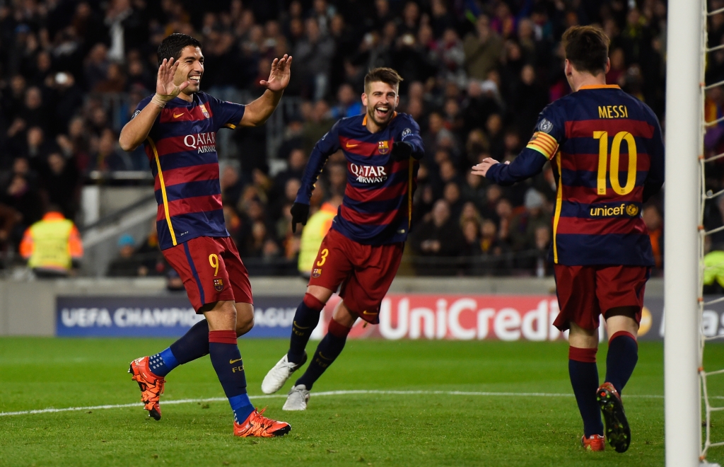 BARCELONA SPAIN- NOVEMBER 24 Gerard Pique of Barcelona celebrates scoring his teams fourth goal with Luis Suarez and Lionel Messi during the UEFA Champions League Group E match between FC Barcelona and AS Roma at Camp Nou