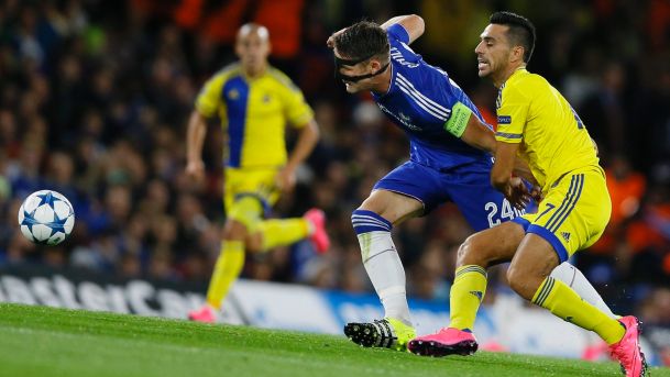 Maccabi's Eran Zahavi right grabbing the arm of Chelsea's Gary Cahill during the Champions League group G soccer match between Chelsea and Maccabi Tel Aviv at Stamford Bridge stadium in London Wednesday Sept. 16 2015