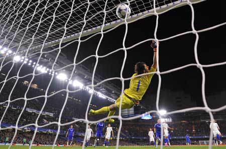 Dynamo Kiev’s Ukrainian goalkeeper Oleksandr Shovkovskiy fails to sop a free kick by Chelsea’s Brazilian midfielder Willian to make it 2-1 during a UEFA Champions league group stage football match between Chelsea and Dynamo Kiev at Stamford B