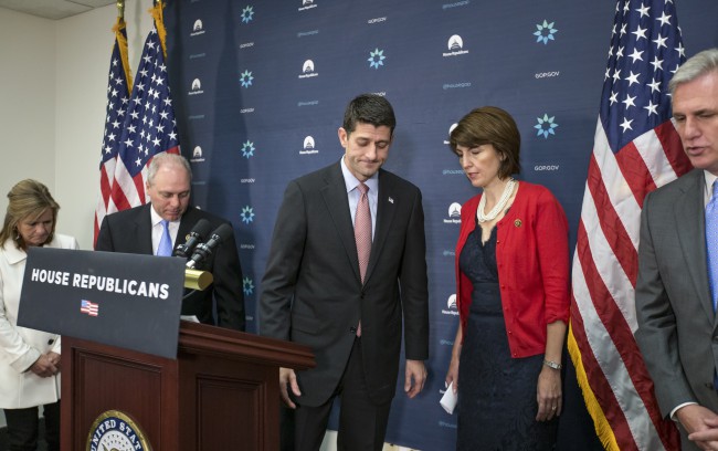 House Speaker Paul Ryan of Wis. center accompanied by from left Rep. Lynn Jenkins R-Kansas House Majority Whip Steve Scalise of La. Rep. Cathy Mc Morris Rodgers R-Wash. chair of the Republican Conference and House Majority Leader Kevin Mc Carthy