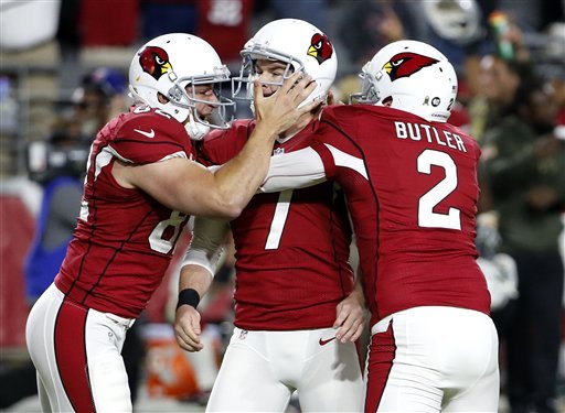 Arizona Cardinals kicker Chandler Catanzaro celebrates his game-winning field goal with punter Drew Butler and snapper Mike Leach against the Cincinnati Bengals during the second half of an NFL football game Sunday Nov. 22 2015 in Glendal