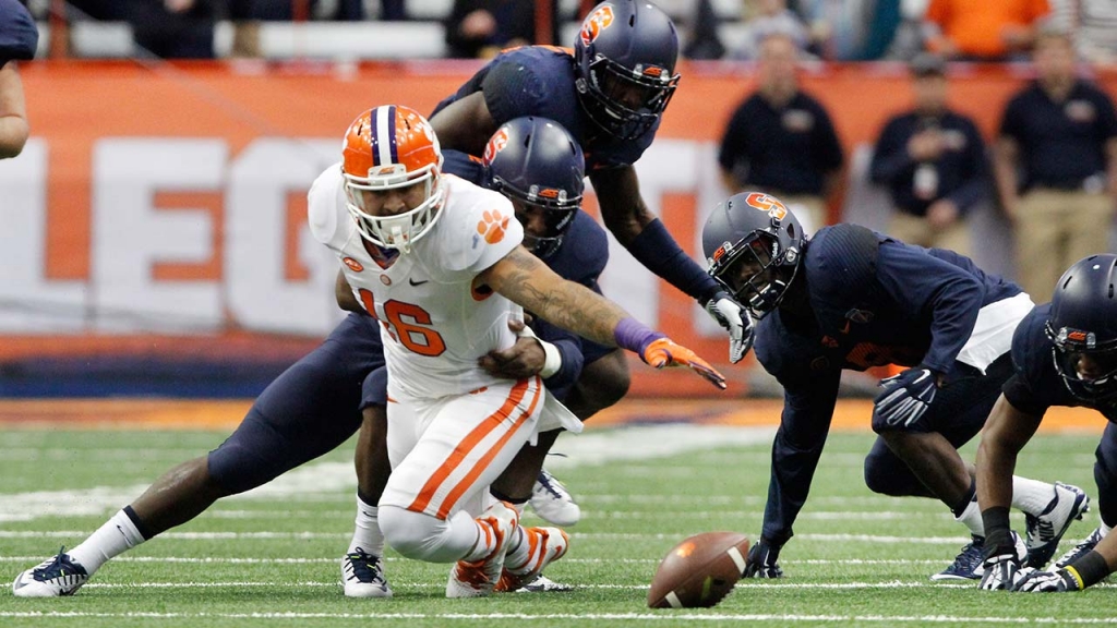 Clemson’s Jordan Leggett left dives for a loose ball that he fumbled with several Syracuse players in the first quarter of an NCAA college football game in Syracuse N.Y. Saturday Nov. 14 2015. Syracuse recovered the fumble