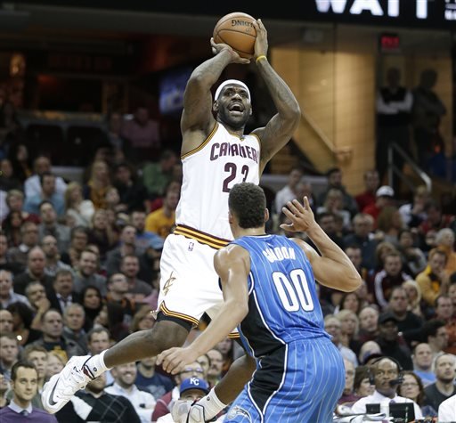 Cleveland Cavaliers Le Bron James shoots over Orlando Magic's Aaron Gordon in the first half of an NBA basketball game Monday Nov. 23 2015 in Cleveland