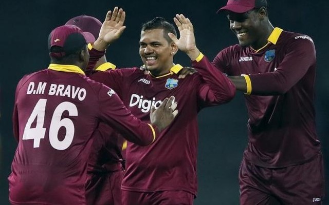 West Indies Sunil Narine celebrates with his teammates after taking the wicket of Sri Lanka's Shehan Jayasuriya during the first One Day International cricket match in Colombo