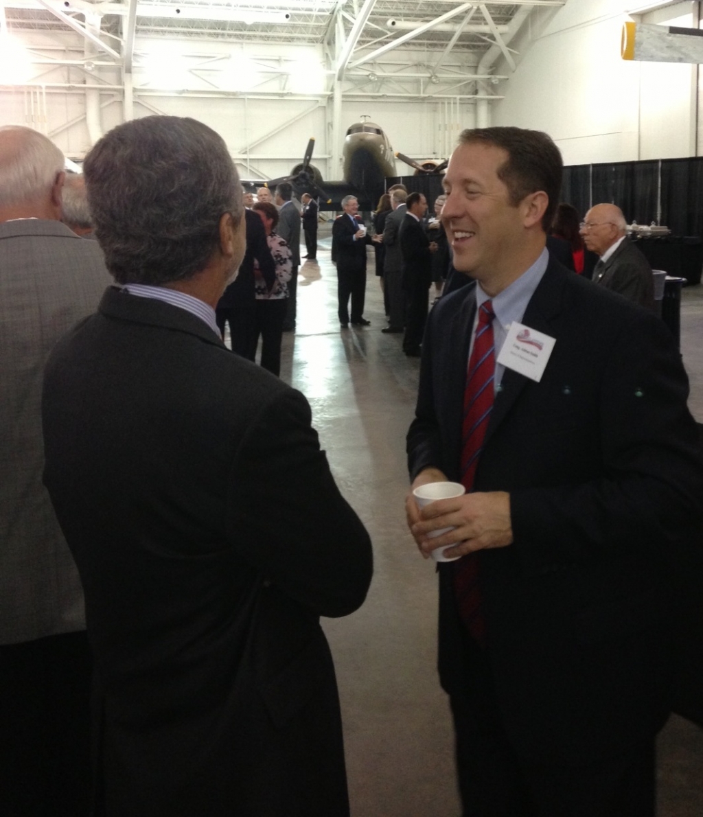 Congressman Adrian Smith talks with a constituent during a legislative summit