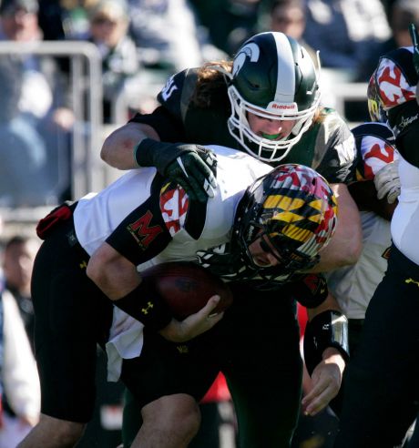 Maryland quarterback Perry Hills bottom is sacked by Michigan State's Riley Bullough during the second quarter of an NCAA college football game Saturday Nov. 14 2015 in East Lansing Mich