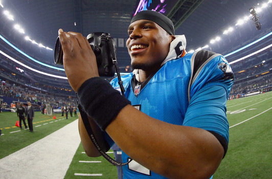 Cam Newton #1 of the Carolina Panthers celebrates after beating the Dallas Cowboys 33-14 at AT&T Stadium