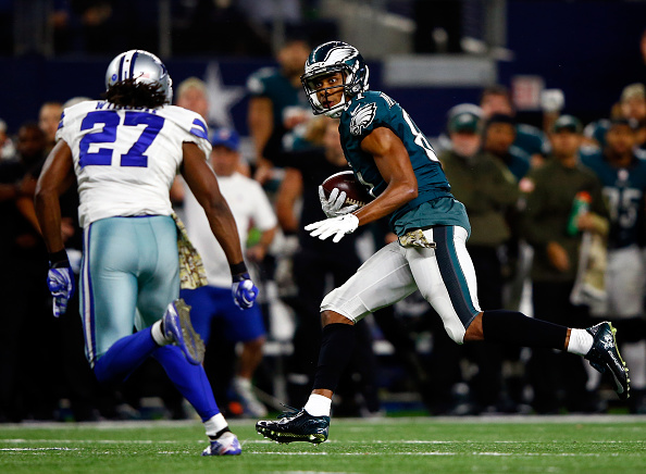 ARLINGTON TX- NOVEMBER 08 Wide receiver Jordan Matthews #81 of the Philadelphia Eagles evades free safety J.J. Wilcox #27 of the Dallas Cowboys on his way toward scoring the game-winning touchdown in overtime as the Eagles defeat the Cowboys with a