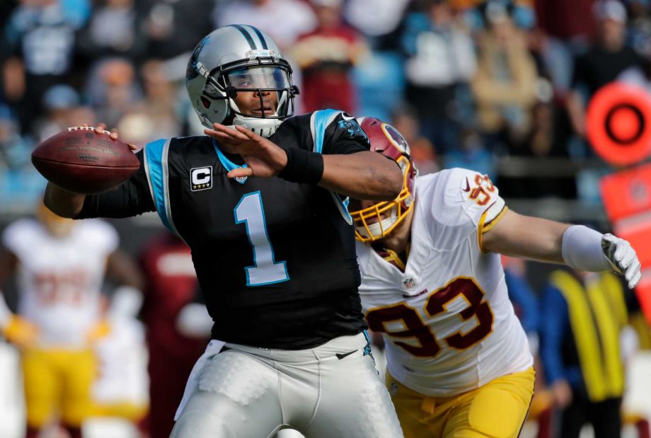 Carolina Panthers Cam Newton looks to pass under pressure from Washington Redskins Trent Murphy in the first half of an NFL football game in Charlotte N.C. Sunday Nov. 22 2015