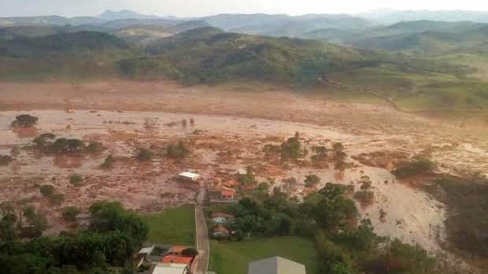 Dam bursts at Brazil mine, submerging homes