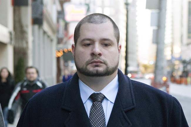 Toronto police officer James Forcillo arrives at Toronto Police Headquarters to attend the opening of a disciplinary hearing on Thursday