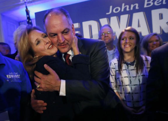 Louisiana Gov.-elect John Bel Edwards hugs his wife Donna as he arrives to greet supporters at his Election Night watch party in New Orleans Saturday night
