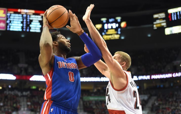 Detroit Pistons center Andre Drummond drives to the basket on Portland Trail Blazers center Mason Plumlee during the first quarter of an NBA basketball game in Portland Ore. Sunday Nov. 8 2015