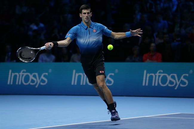 Serbia's Novak Djokovic plays a return to Japan's Kei Nishikori during their ATP World Tour Finals tennis match at the O2 Arena in London England Sunday Nov. 15 2015