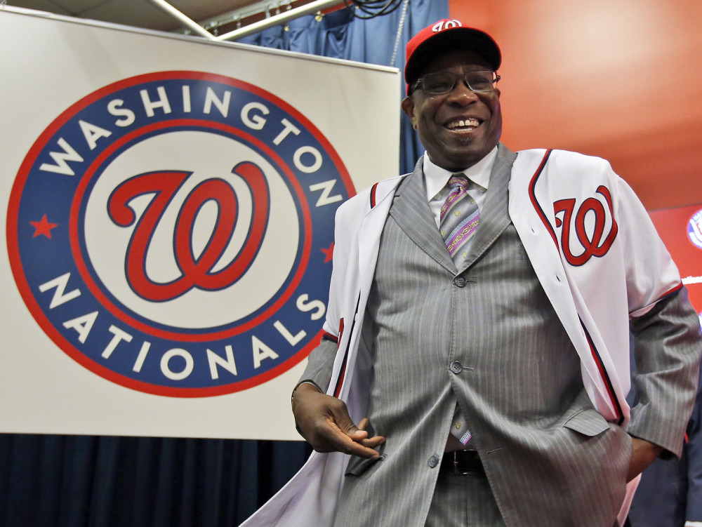 Dusty Baker smiles as he wears his new jersey and hat during a news conference to present Baker as the new manager of the Washington Nationals on Thursday Nov. 5 2015 in Washington D.C