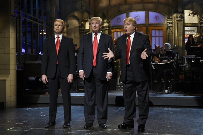 Taran Killam left Republican presidential candidate and guest host Donald Trump center and Darrell Hammond perform during the monologue