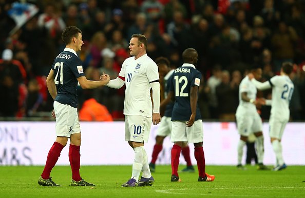 Wayne Rooney of England and Laurent Koscielny