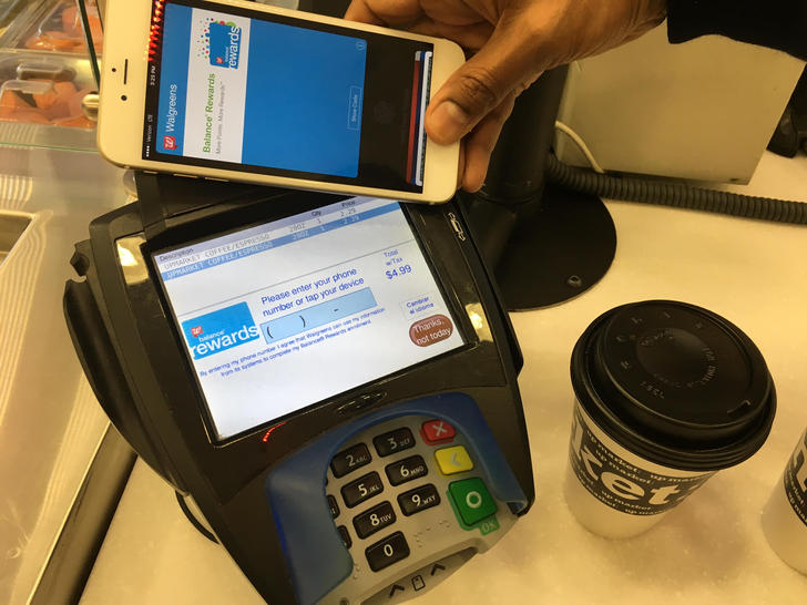 Enlarge Image Making a purchase using Apple Pay on an iPhone integrated with Walgreens Balance Rewards digital card.      Scott Stein CNET