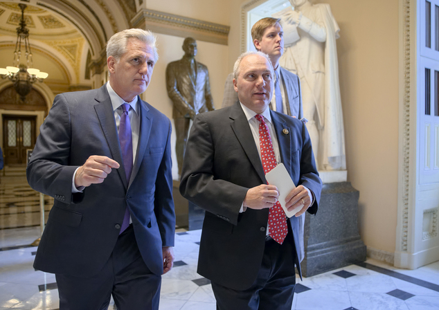 House Majority Leader Kevin Mc Carthy of Calif. left and House Majority Whip Steve Scalise of La. stride from the House chamber on Capitol Hill in Washingt