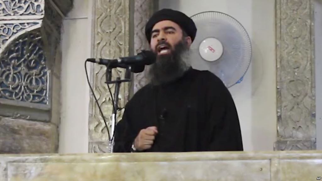 FILE- This image from video purports to show Islamic State leader Abu Bakr al Baghdadi delivering a sermon in Iraq