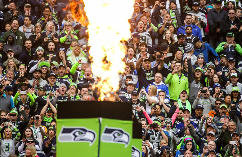 Fans cheer during introductions as the Seattle Seahawks take on the Carolina Panthers at Century Link Field in Seattle Sunday