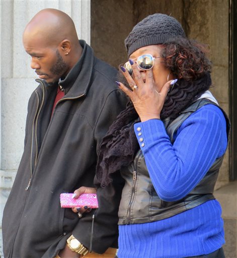 Nate Hamilton and his mother Maria Hamilton attend a news conference in Milwaukee Wis. on Tuesday Nov. 10 2015. The U.S. Justice Department said Tuesday it wouldn't pursue criminal civil rights charges against Christopher Manney a white Milwauk