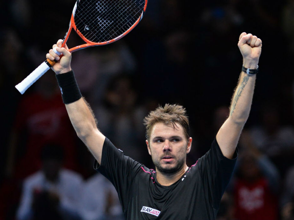 Switzerland's Stan Wawrinka celebrates after beating Britain's Andy Murray in a men's singles group stage match at the ATP World Tour finals in London on Friday