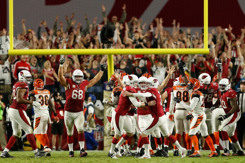 Kicker Chandler Catanzaro of the Arizona Cardinals is congratulated after kicking the game-winning field goal during the final moments against the Cincinnati Bengals