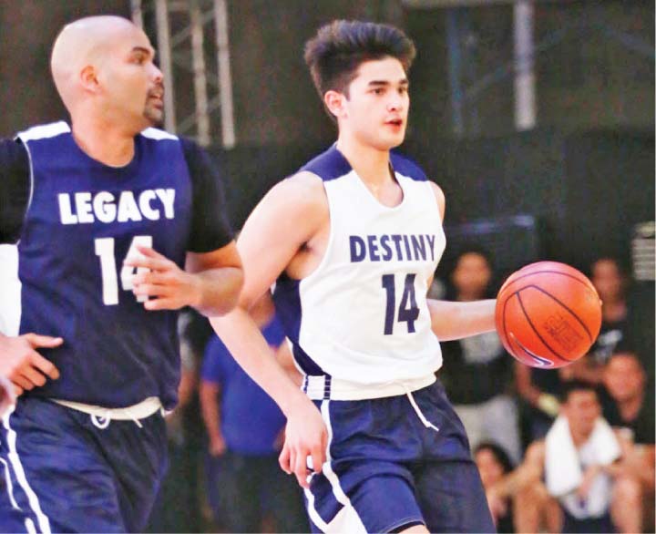 Kobe Paras playing against his father Benjie during an exhibition game recently is set to play for the UCLA Bruins of the US NCAA next season