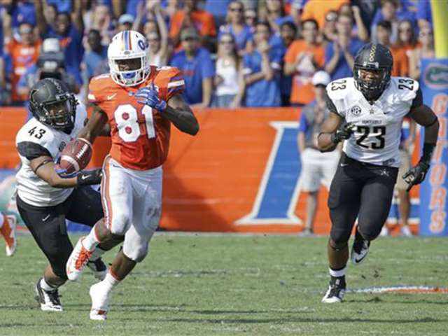 Florida's Antonio Callaway returns a punt for 28-yards as he gets past Vanderbilt linebackers Jordan Griffin and Khari Blasing during the second half of an NCAA college football game Saturday Nov. 7 2015 in Gainesville Fla. Florid