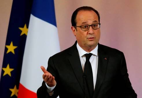 France's President Francois Hollande leaves a news conference on climate change for agricultural sector before the upcoming COP21 World Climate Summit