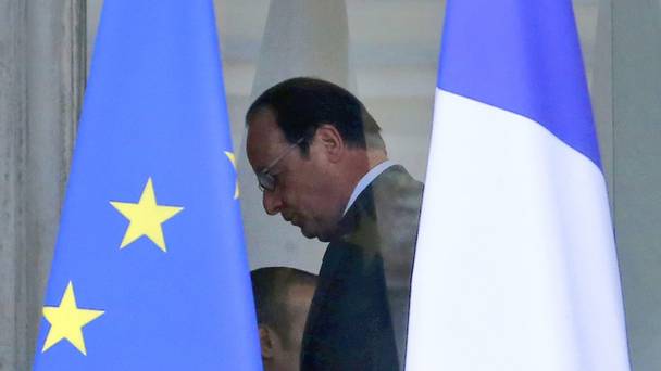 French president Francois Hollande walks through the lobby of the Elysee Palace