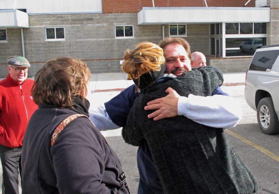 Barry Beach hugs a reporter as he departs Montana State Prison in Deer Lodge Mont. on Friday after his prison sentence was commuted by the governor