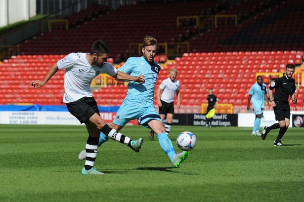 Gateshead's Josh Gillies 10 with Boreham Wood's 16 Connor Clifford