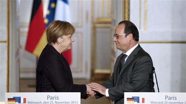 French President Francois Hollande shakes hands with German Chancellor Angela Merkel after a joint press conference at the Elysee presidential palace in Paris