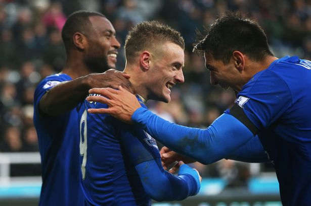 Jamie Vardy of Leicester City celebrates scoring his team's first goal with his team mates