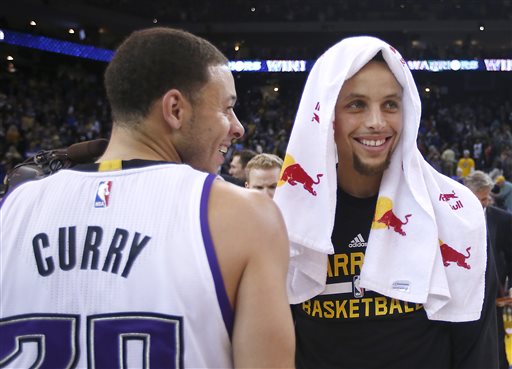 Sacramento Kings guard Seth Curry his brother after an NBA basketball game Saturday Nov. 28 2015 in Oakland Calif. The Warriors won 120-101