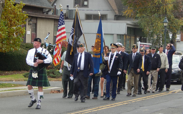 Bagpiper Drew Kennedy led veterans from Wilton Library to the Veterans Memorial during last year's Wilton Veterans Day parade and ceremony. — Kendra Baker